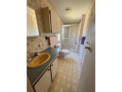 Take a look at this charming and spacious partially furnished on Lake Henry Golf Club in Florida - for sale on GolfHomes.com, golf home, golf lot