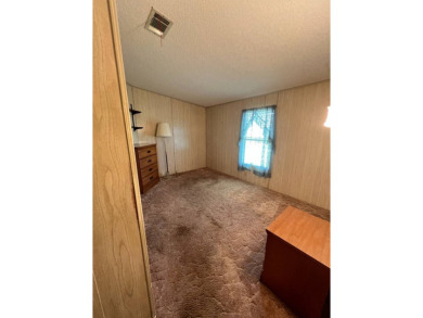 Take a look at this charming and spacious partially furnished on Lake Henry Golf Club in Florida - for sale on GolfHomes.com, golf home, golf lot