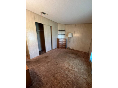 Take a look at this charming and spacious partially furnished on Lake Henry Golf Club in Florida - for sale on GolfHomes.com, golf home, golf lot