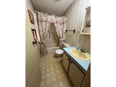 Take a look at this charming and spacious partially furnished on Lake Henry Golf Club in Florida - for sale on GolfHomes.com, golf home, golf lot