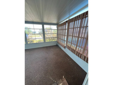 Take a look at this charming and spacious partially furnished on Lake Henry Golf Club in Florida - for sale on GolfHomes.com, golf home, golf lot
