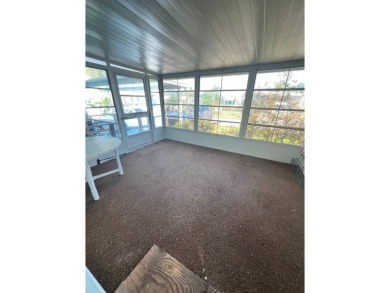 Take a look at this charming and spacious partially furnished on Lake Henry Golf Club in Florida - for sale on GolfHomes.com, golf home, golf lot