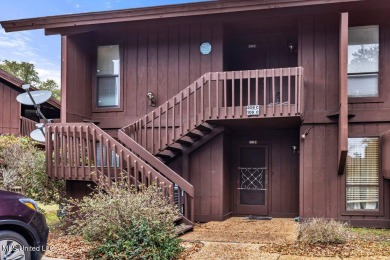 Discover the charm of this inviting 1-bedroom, 1-bath upstairs on Diamondhead Country Club in Mississippi - for sale on GolfHomes.com, golf home, golf lot