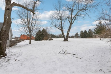 Located on a serene half-acre lot overlooking the South Course on Evergreen Golf Club in Wisconsin - for sale on GolfHomes.com, golf home, golf lot