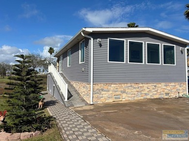 Golf course beauty with huge windows framing stunning views on Long Island Golf Course in Texas - for sale on GolfHomes.com, golf home, golf lot