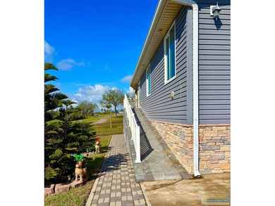 Golf course beauty with huge windows framing stunning views on Long Island Golf Course in Texas - for sale on GolfHomes.com, golf home, golf lot
