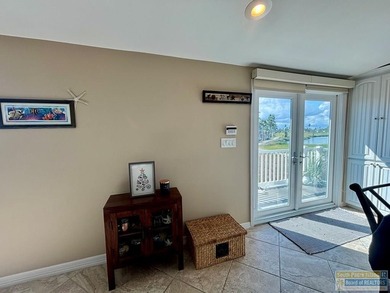 Golf course beauty with huge windows framing stunning views on Long Island Golf Course in Texas - for sale on GolfHomes.com, golf home, golf lot