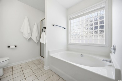 Welcome home to this warm and inviting 4-bedroom, 2-bath home on Palmetto Greens Golf and Country Club in South Carolina - for sale on GolfHomes.com, golf home, golf lot