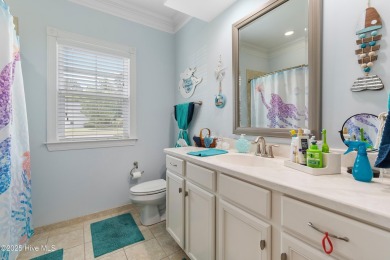 Discover this stunning 4-bedroom, 3-bath custom Craftsman home on Carolina National Golf Club in North Carolina - for sale on GolfHomes.com, golf home, golf lot