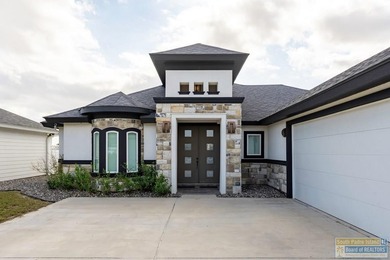 Beautiful lakefront home in the SPI Golf Community! This on South Padre Island Golf Club in Texas - for sale on GolfHomes.com, golf home, golf lot