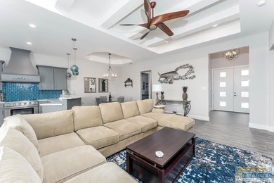 Beautiful lakefront home in the SPI Golf Community! This on South Padre Island Golf Club in Texas - for sale on GolfHomes.com, golf home, golf lot