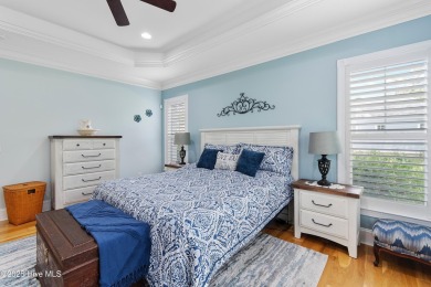 Discover this stunning 4-bedroom, 3-bath custom Craftsman home on Carolina National Golf Club in North Carolina - for sale on GolfHomes.com, golf home, golf lot