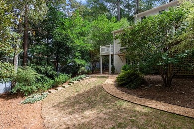 Beautifully situated on a peaceful +/-1.2-acre lot in one of on North Fulton Golf Course in Georgia - for sale on GolfHomes.com, golf home, golf lot