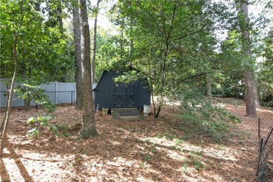Beautifully situated on a peaceful +/-1.2-acre lot in one of on North Fulton Golf Course in Georgia - for sale on GolfHomes.com, golf home, golf lot