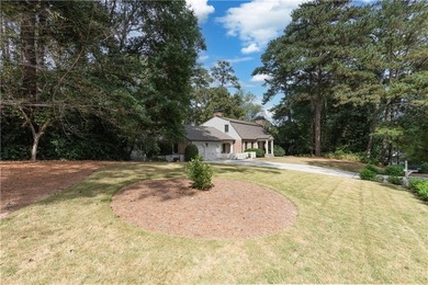 Beautifully situated on a peaceful +/-1.2-acre lot in one of on North Fulton Golf Course in Georgia - for sale on GolfHomes.com, golf home, golf lot