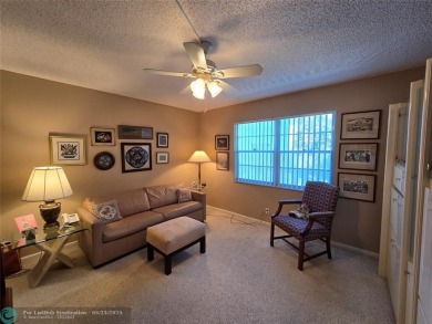 Enjoy golf course views from this beautifully maintained on Wynmoor Golf Course in Florida - for sale on GolfHomes.com, golf home, golf lot