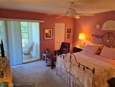 Enjoy golf course views from this beautifully maintained on Wynmoor Golf Course in Florida - for sale on GolfHomes.com, golf home, golf lot