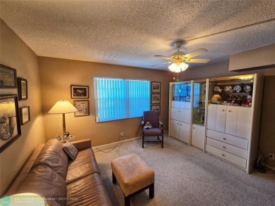 Enjoy golf course views from this beautifully maintained on Wynmoor Golf Course in Florida - for sale on GolfHomes.com, golf home, golf lot