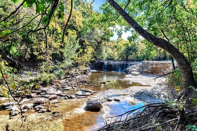Situated just steps from the tranquil Prairie Creek Park and its on Canyon Creek Country Club in Texas - for sale on GolfHomes.com, golf home, golf lot