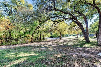 Situated just steps from the tranquil Prairie Creek Park and its on Canyon Creek Country Club in Texas - for sale on GolfHomes.com, golf home, golf lot