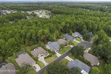 This home offers a formal living or flex space & a formal dining on Julington Creek Golf Club in Florida - for sale on GolfHomes.com, golf home, golf lot