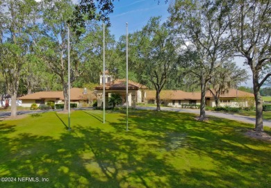 This home offers a formal living or flex space & a formal dining on Julington Creek Golf Club in Florida - for sale on GolfHomes.com, golf home, golf lot