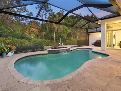 Gracefully positioned on an exceptionally private preserve on Bay Colony Golf Club in Florida - for sale on GolfHomes.com, golf home, golf lot