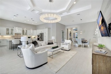 Indulge in modern luxury at this exquisite STOCK LUXURY home in on The Golf Club At Fiddlers Creek in Florida - for sale on GolfHomes.com, golf home, golf lot