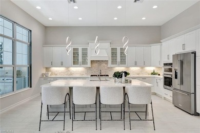 Indulge in modern luxury at this exquisite STOCK LUXURY home in on The Golf Club At Fiddlers Creek in Florida - for sale on GolfHomes.com, golf home, golf lot