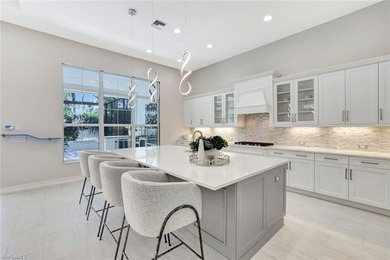 Indulge in modern luxury at this exquisite STOCK LUXURY home in on The Golf Club At Fiddlers Creek in Florida - for sale on GolfHomes.com, golf home, golf lot