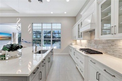 Indulge in modern luxury at this exquisite STOCK LUXURY home in on The Golf Club At Fiddlers Creek in Florida - for sale on GolfHomes.com, golf home, golf lot