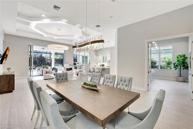 Indulge in modern luxury at this exquisite STOCK LUXURY home in on The Golf Club At Fiddlers Creek in Florida - for sale on GolfHomes.com, golf home, golf lot