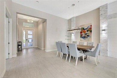 Indulge in modern luxury at this exquisite STOCK LUXURY home in on The Golf Club At Fiddlers Creek in Florida - for sale on GolfHomes.com, golf home, golf lot