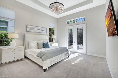 Indulge in modern luxury at this exquisite STOCK LUXURY home in on The Golf Club At Fiddlers Creek in Florida - for sale on GolfHomes.com, golf home, golf lot