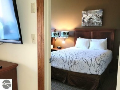 This one-bedroom suite is ideal for those looking for a place to on Cedar River Golf Course in Michigan - for sale on GolfHomes.com, golf home, golf lot