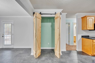 Welcome to this spacious 4-bedroom, 2-bath home in the highly on The International City Golf Course in Georgia - for sale on GolfHomes.com, golf home, golf lot