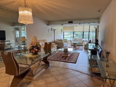 This spacious 2-bedroom, 2-bath Whitehall condo is located in on Pine Island Ridge Country Club in Florida - for sale on GolfHomes.com, golf home, golf lot