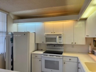 This spacious 2-bedroom, 2-bath Whitehall condo is located in on Pine Island Ridge Country Club in Florida - for sale on GolfHomes.com, golf home, golf lot