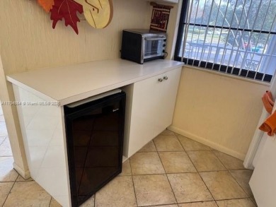 This spacious 2-bedroom, 2-bath Whitehall condo is located in on Pine Island Ridge Country Club in Florida - for sale on GolfHomes.com, golf home, golf lot
