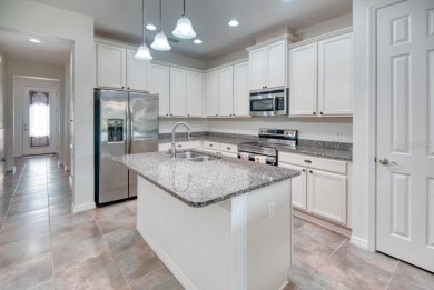 Move-in ready Avellino model, featuring a Courtyard entry to on Stonegate Golf Club in Florida - for sale on GolfHomes.com, golf home, golf lot