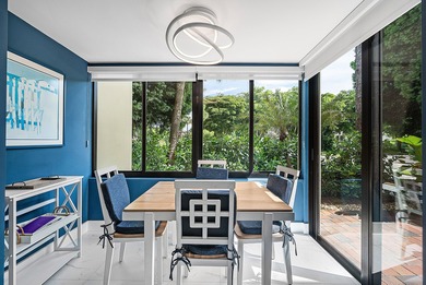 Welcome to this inviting 1st‑floor home showcasing serene on Quail Ridge Golf Course and Country Club in Florida - for sale on GolfHomes.com, golf home, golf lot