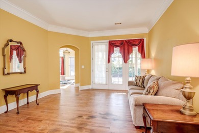 Located in an exclusive gated community this beautiful custom on The Reserve Club At Woodside Plantation in South Carolina - for sale on GolfHomes.com, golf home, golf lot