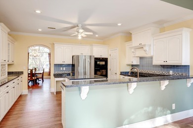Located in an exclusive gated community this beautiful custom on The Reserve Club At Woodside Plantation in South Carolina - for sale on GolfHomes.com, golf home, golf lot