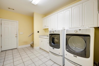 Located in an exclusive gated community this beautiful custom on The Reserve Club At Woodside Plantation in South Carolina - for sale on GolfHomes.com, golf home, golf lot