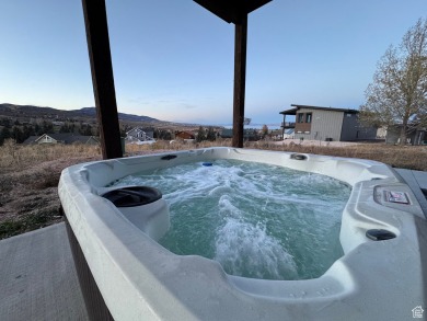 This ultra-modern home overlooks Bear Lake with 5 bedrooms, 4 on Bear Lake Golf Course in Utah - for sale on GolfHomes.com, golf home, golf lot