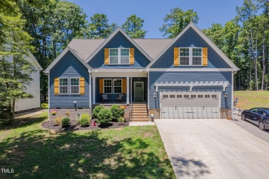 Resort-style living awaits in this beautifully crafted 2023 on River Golf and County Club at Lake Royale in North Carolina - for sale on GolfHomes.com, golf home, golf lot
