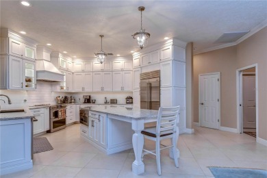 Prepare to be dazzled by this stunning residence! If you're in on River Hills Country Club in Florida - for sale on GolfHomes.com, golf home, golf lot