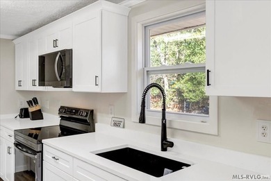 A renovated ranch on the shores of Poplar Creek. Privacy awaits on Tanglewood Shores Golf Club in Virginia - for sale on GolfHomes.com, golf home, golf lot