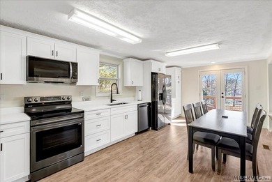 A renovated ranch on the shores of Poplar Creek. Privacy awaits on Tanglewood Shores Golf Club in Virginia - for sale on GolfHomes.com, golf home, golf lot