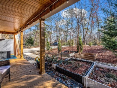 Offered turnkey and fully furnished, this energy efficient newer on Rumbling Bald Resort on Lake Lure in North Carolina - for sale on GolfHomes.com, golf home, golf lot